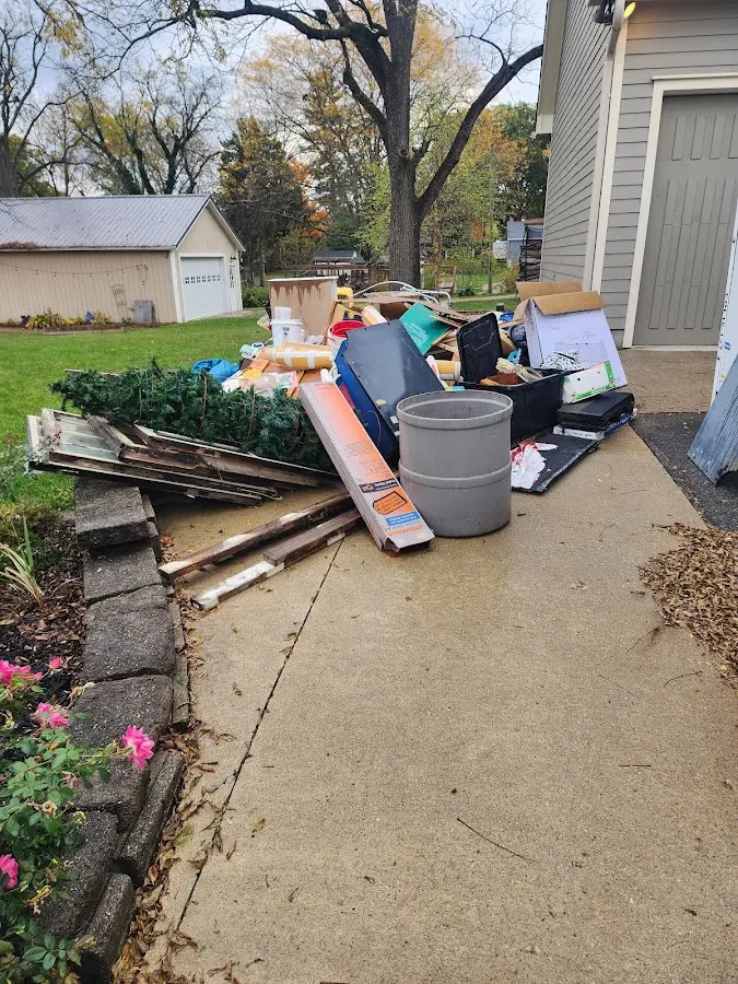 Dumpster being loaded with debris for Commercial Dumpster Rental in East Vincent